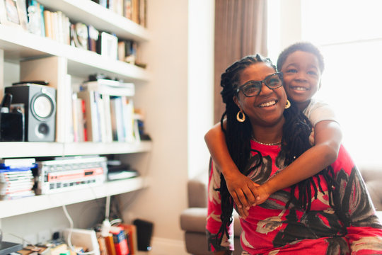 Happy grandmother and grandson hugging