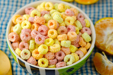 Cereal flakes in bowl Breakfast concept.Food with delicious fruity taste and fruity colours.It's made with maize,wheat,and barley