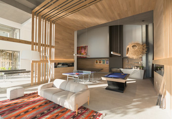 Pool table and ping pong table in modern, luxury home showcase interior game room