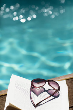 Heart-shape sunglasses at poolside