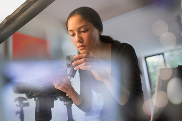 Female photographer working in studio