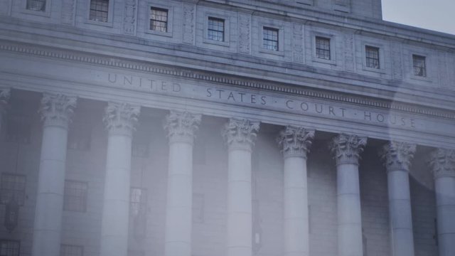 Unites States Court House in New York City, camera pan across with lens flare.