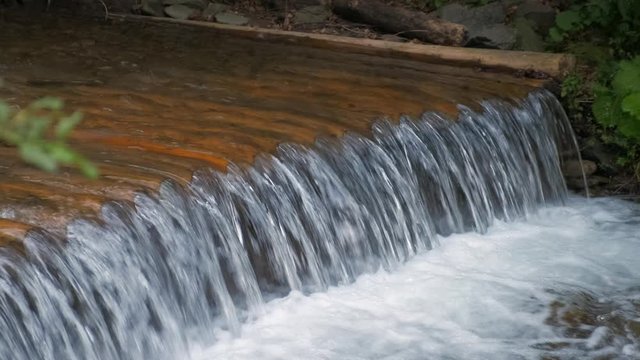 Mountain waterfall. Carpathian mountains. 4K. Slow motion