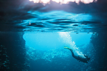 Woman scuba diving underwater, Vava'u, Tonga, Pacific Ocean