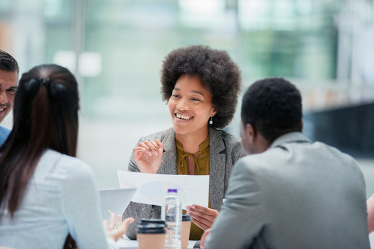 Happy businesswoman talking in meeting