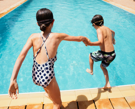 Boy and girl at swimming pool