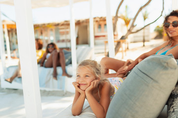 Carefree girl relaxing on beach patio