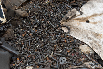 Close-up of old parts, nuts and bolts.