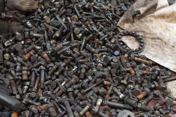 Close-up of old parts, nuts and bolts.