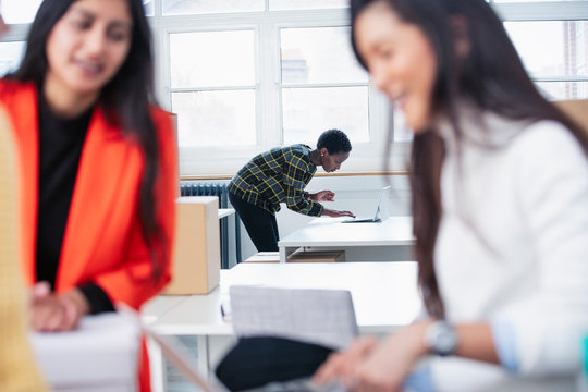 Businesswomen working in new office