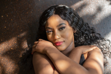 Portrait sexy beautiful young woman with black curly hair