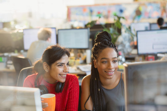Businesswomen meeting, working at computer in office