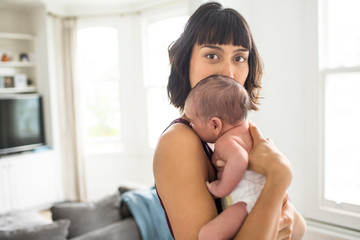 Portrait beautiful mother holding newborn baby son