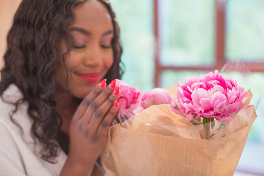 Young Woman Smelling Fresh Pink Peony Flower Bouquet