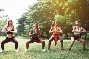 Group of sporty young woman doing workout at public park in the morning,Best friends warming up...