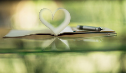 Notebook pages forming heart shape