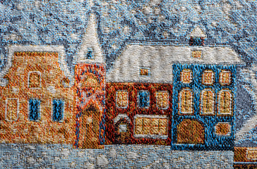 tapestry fragment winter city landscape houses under  snow close-up europe art background 