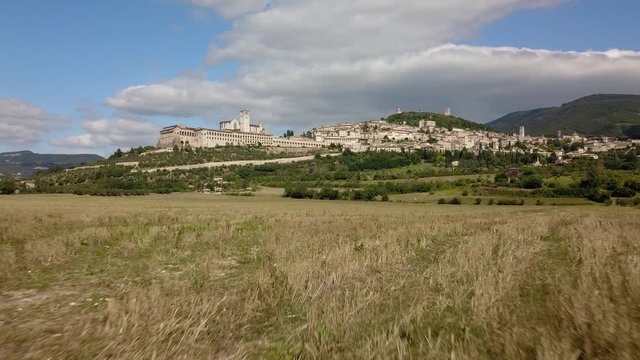 Aerial Drone Shot of Assisi Town in Umbria Italy, Beautiful Italian Hillside City and Town during Summer