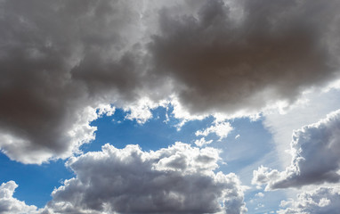 Blue sky and large clouds that are overcast