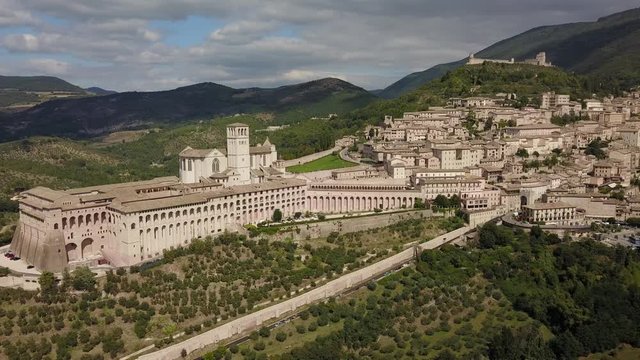 Aerial Drone Shot of Assisi Town in Umbria Italy, Beautiful Italian Hillside City and Town during Summer
