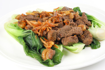 Soy ginger beef on bed of blanched bok choy