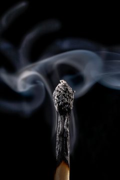 Burnt matchstick and smoke