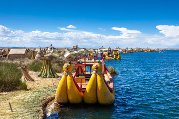 Close-up traditional reed boat as transportation for tourists, floating Uros islands on lake Titicaca in Peru, South America.