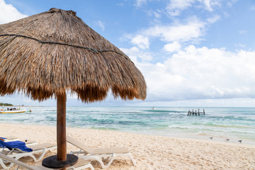 Coconut Palm Leaf Beach Umbrella With Blue Sky and Copy Space