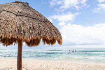 Fototapeta na wymiar Coconut Palm Leaf Beach Umbrella With Blue Sky and Copy Space