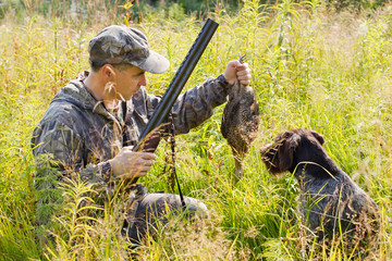 the dog returned the downed grouse to the hunter