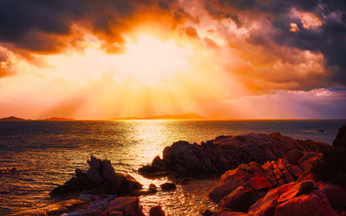 Landscape with Romantic sunset at Capriccioli Beach in of the Mediterranean sea on Sardinia island...