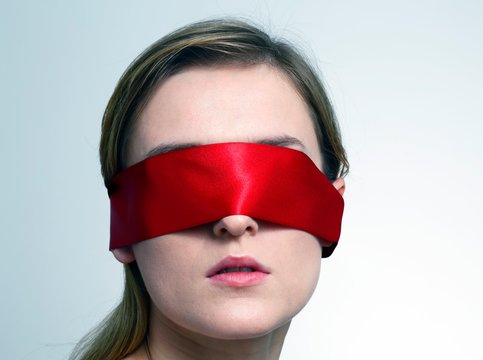 Woman wearing red blindfold
