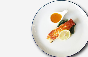 Top view of Salmon steak dish with sauce