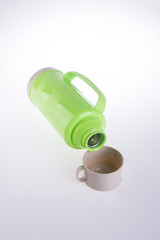 Thermo or Plastic Thermos flask on background new.