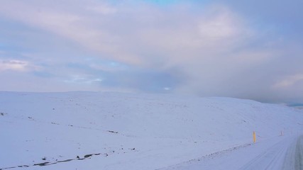 Driving Through Snow Covered Landscape in Iceland During Sunset - Powered by Adobe