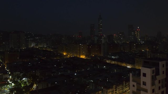 Taiwan, Taipei, City skyline and Taipei 101 building - night to day time lapse