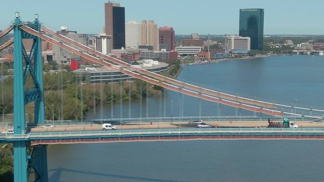 Aerial: Traffic crossing the Anthony Wayne Bridge over Maumee River and downtown Toledo. Ohio, USA