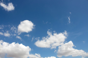 Naklejka na ściany i meble Bright blue sky with white clouds for background or wallpapers