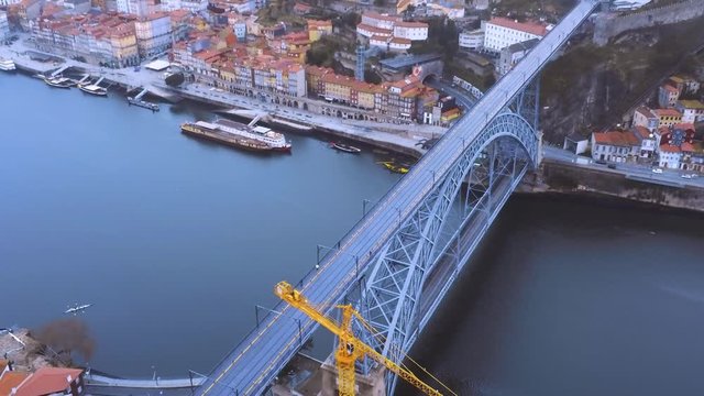 View of Dom Luis Bridge  or Eiffel Bridge and Douro river in Porto, Portugal. Aerial Video