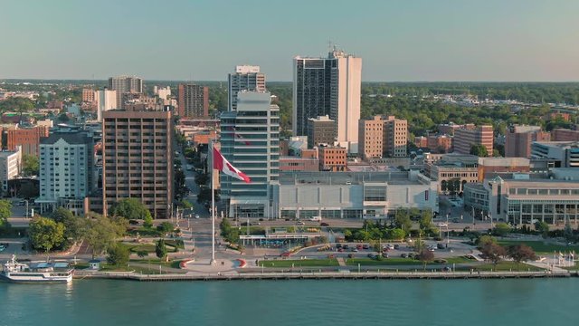 Aerial: Downtown Windsor and the Detroit River at sunset. Ontario, Canada
