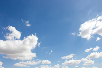 Naklejka na ściany i meble Bright blue sky with white clouds for background or wallpapers