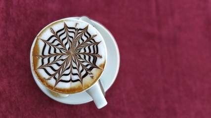 cup of cappuccino. white cup and cappuccino foam