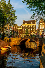 Beautiful view of a bridge over a canal in Amsterdam, Netherlands.