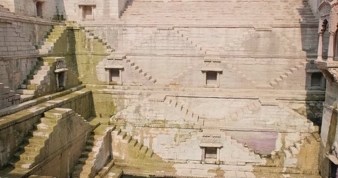 Toorji Ka Jhalra Baoli stepwell and water storage inside it - one of water sources in Jodhpur, Rajasthan, India. Vertical pan