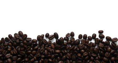 Roasted coffee beans on white background.