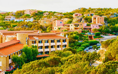 Fototapeta premium Landscape and scenery of Baja Sardinia luxury resort on at sunset in the evening, Sardegna island in Italy summer. Olbia province. Villa at Mediteranean sea