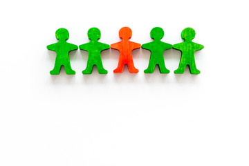 Leader concept. People cutuots - red figure against others on white background top-down copy space