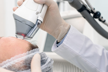 Closeup photo of woman having face polishing procedure in beauty salon