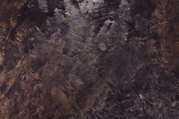 Beautiful abstract grunge background. Decorative dark brown background. Brown textured background. Copper color background with scratches. Horizontal.