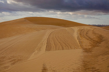 Fototapeta na wymiar Siwa Oasis, Egypt The sand dunes outside the oasis at sunset.